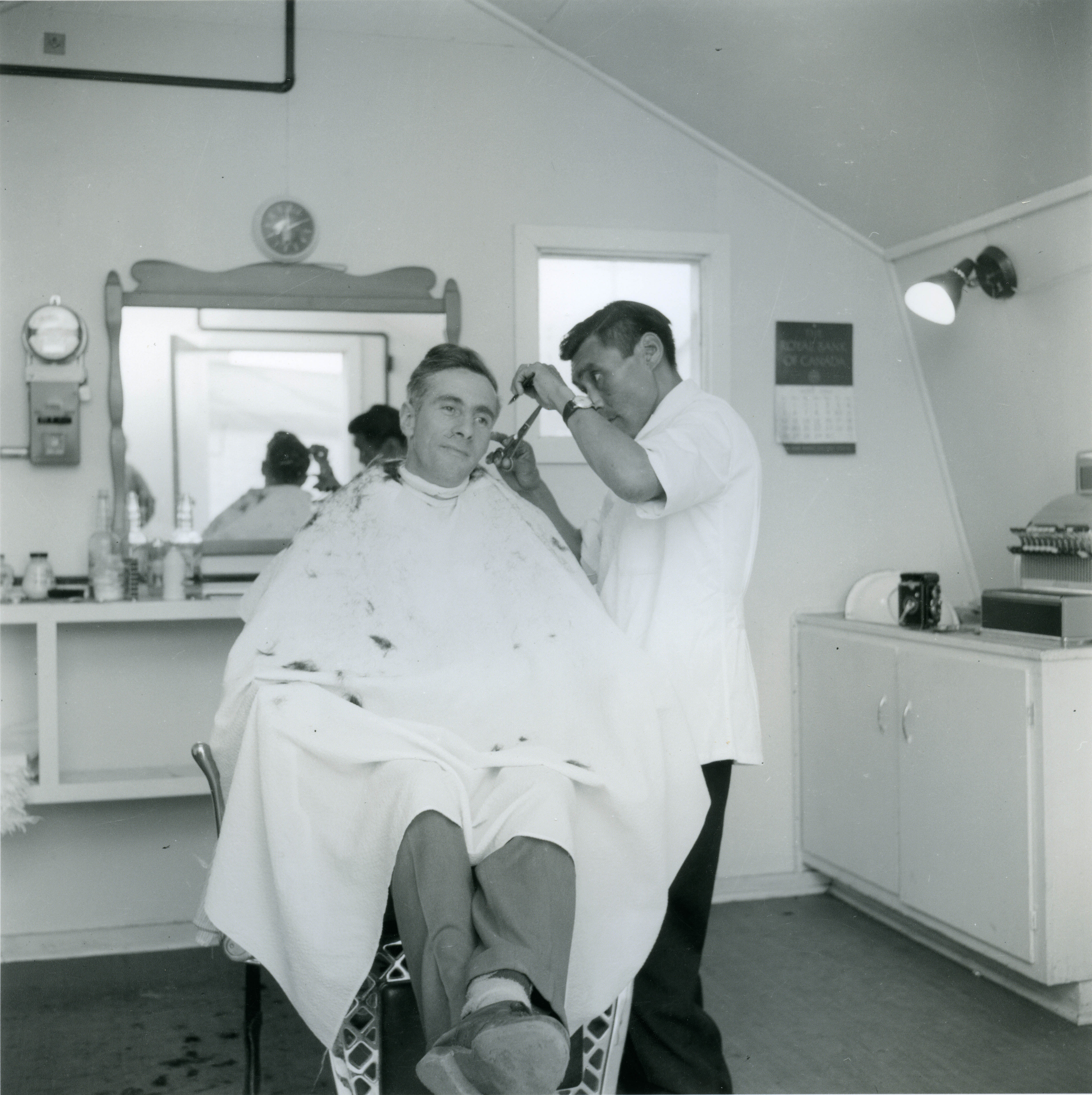 Barber cutting hair