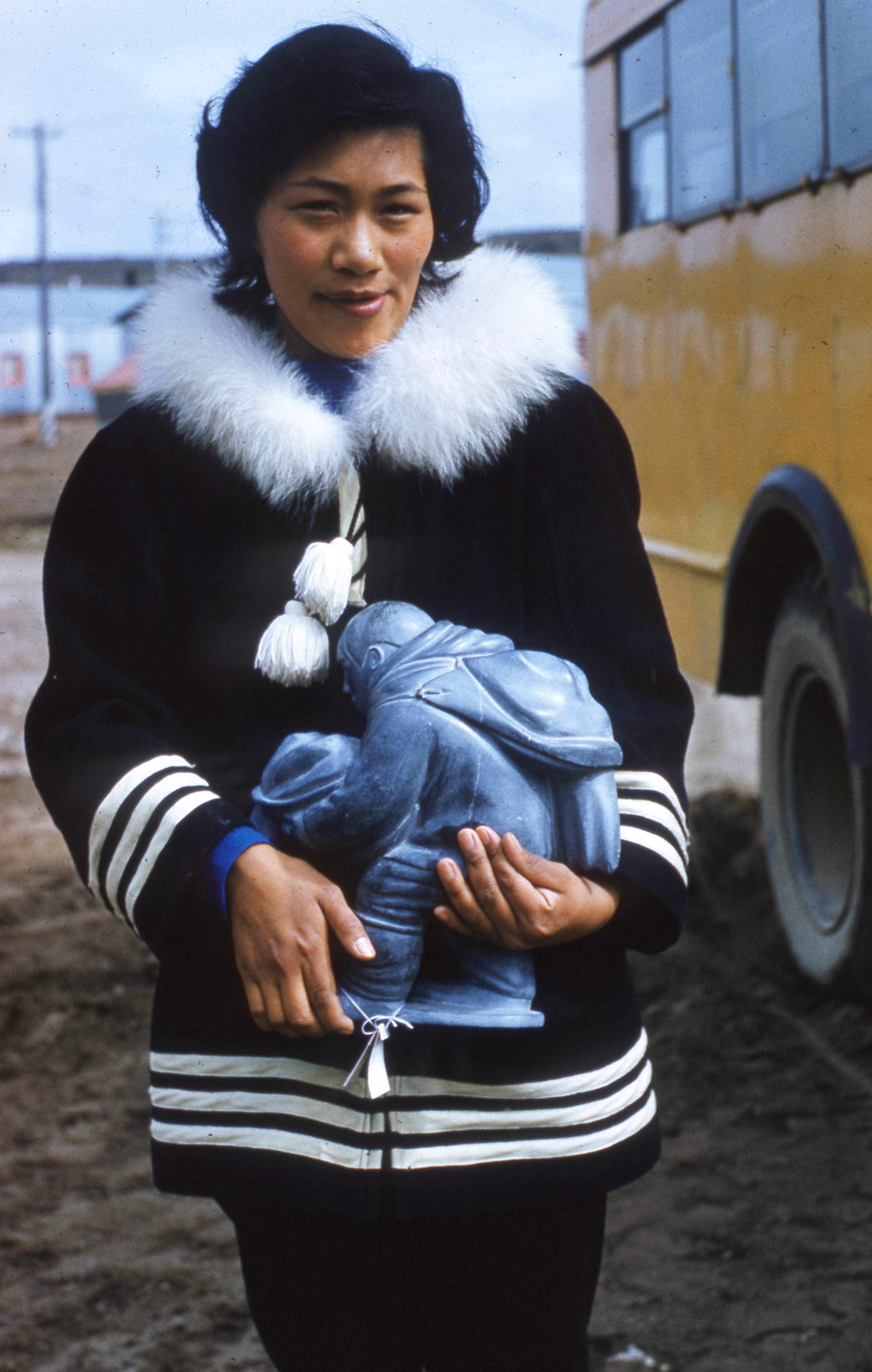 Woman holding soapstone carving