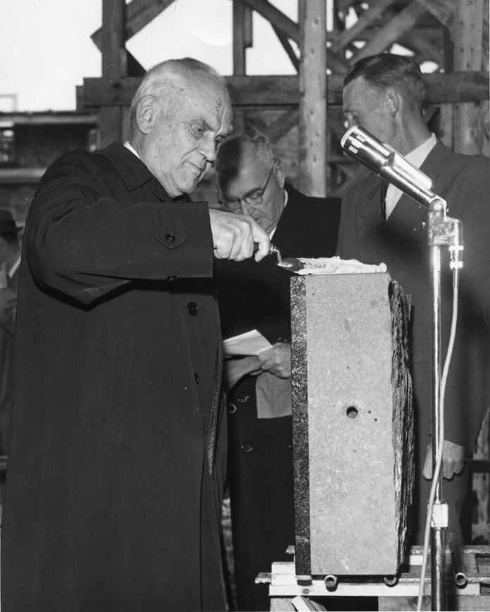 Photograph of C.D. Howe laying the cornerstone of the men’s residence.