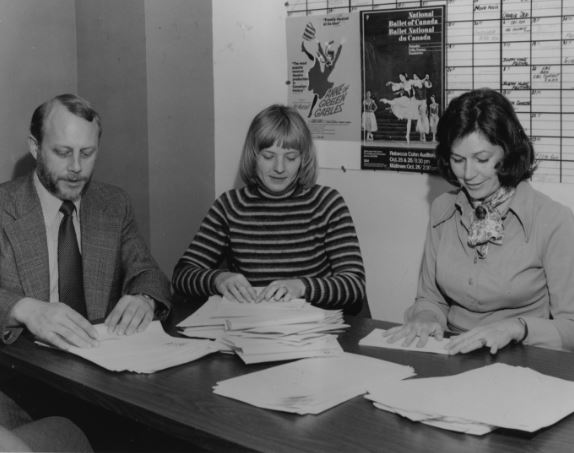 Photograph of Eric Perth, M. Riding and Laura Bennet.